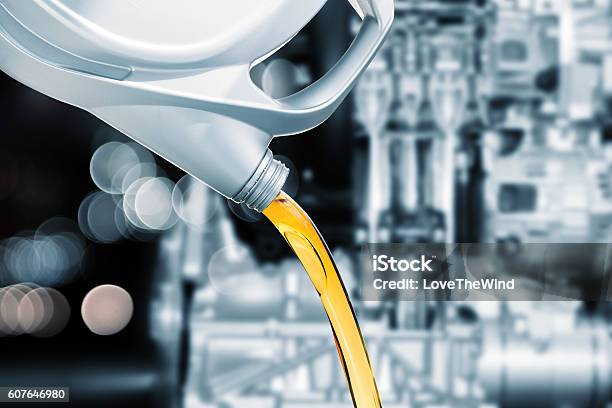 Pouring Motor Oil On Engine Background Stock Photo - Download Image Now - Lubrication, Engine, Blank