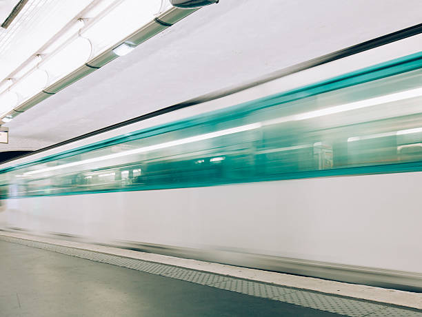 Blurred Metro Train Detail Detail of Blur Motion Paris Metro Train leaving from subway station in Paris, France blurred motion street car green stock pictures, royalty-free photos & images