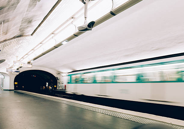 Paris Metro Blur Motion Paris Metro Train leaving from subway station in Paris, France blurred motion street car green stock pictures, royalty-free photos & images