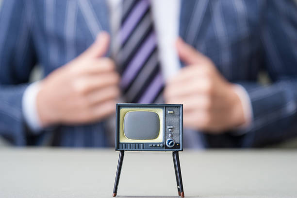 istock Businessman and TV 607648904