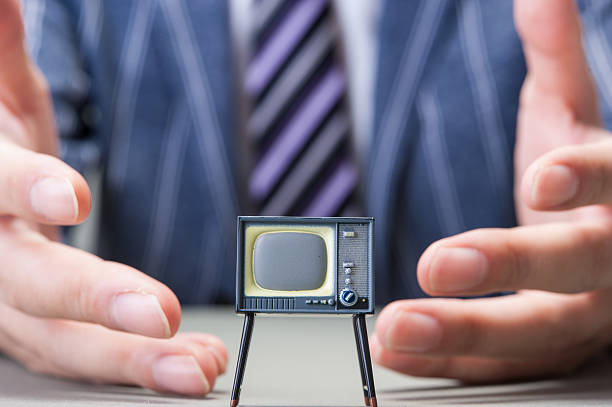 istock Businessman and TV 607649046
