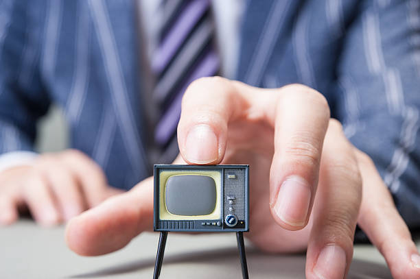 istock Businessman and TV 607649090
