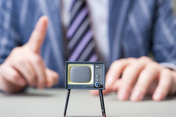 istock Businessman and TV 607649182