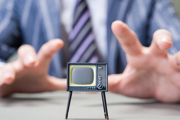 istock Businessman and TV 607649232