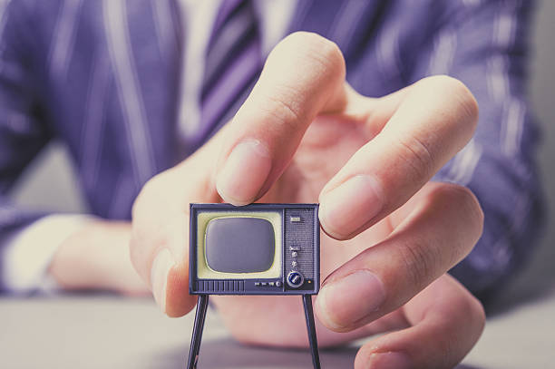 istock Businessman and TV 607649284