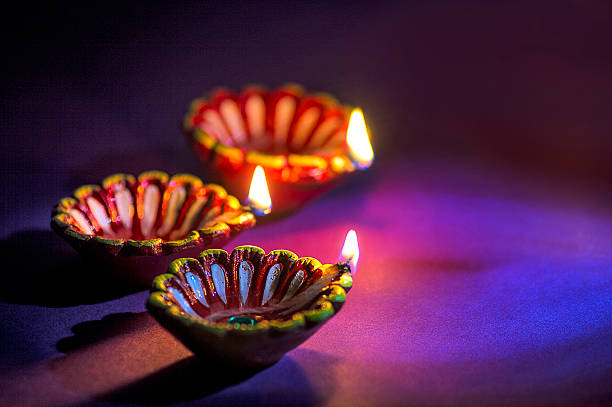 istock Clay diya lamps lit during Diwali Celebration. Greetings Card Design 607649584