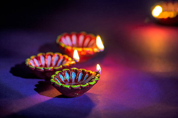 istock Clay diya lamps lit during Diwali Celebration. Greetings Card Design 607650176