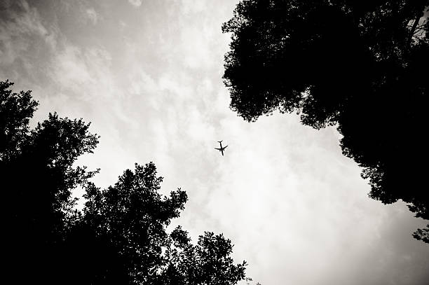 istock Airplane far in the sky from the ground 607650766