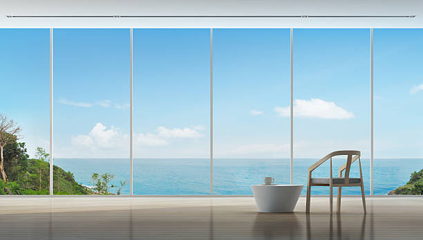 heure du café dans l’intérieur de luxe vue sur la mer de la maison moderne - looking at view water sea blue photos et images de collection