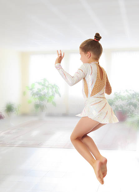 istock Little gymnast jumping 607652442