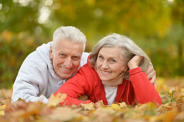 istock couple in autumn park 607653878