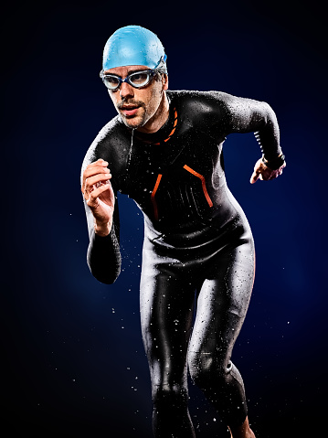 one caucasian  man triathlon ironman swimmer swimming   isolated