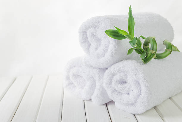 istock White bath towels and Lucky bamboo 607654770