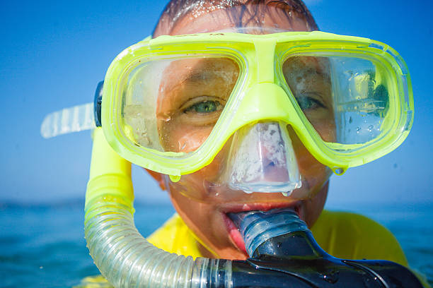 istock Photo of snorkeling boy 607655666
