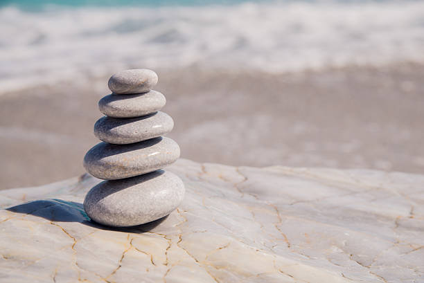istock The pyramid of pebbles on the beach 607655810