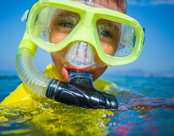 istock Photo of snorkeling boy 607655928
