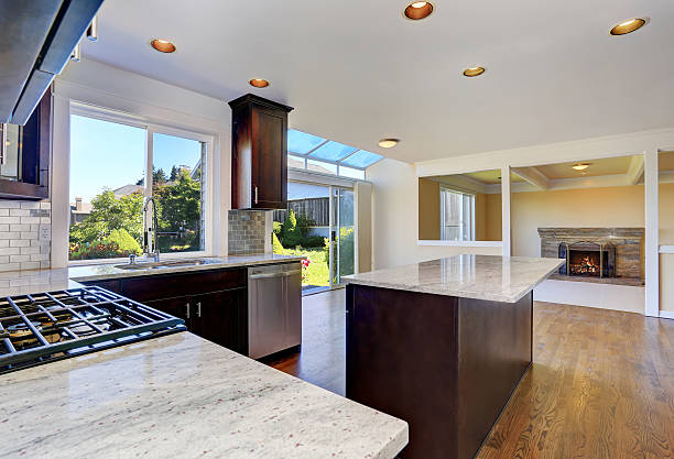 istock Kitchen room with deep brown cabinets with granite counter top 607730922