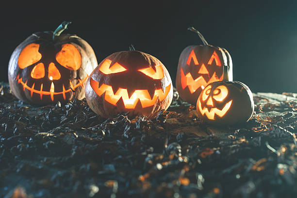 istock Halloween pumpkins at wood background. 607731622
