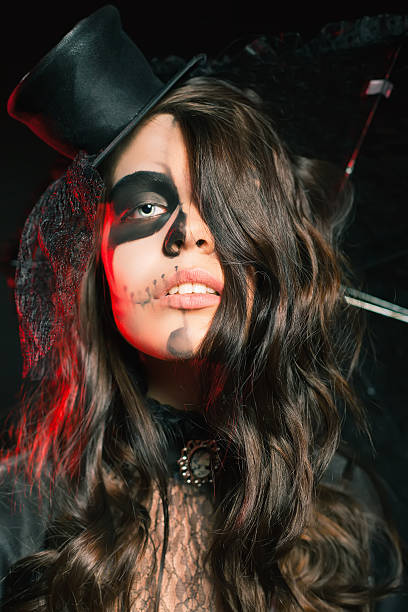 istock Beautiful hairstyle and scary makeup at Halloween party 607732502