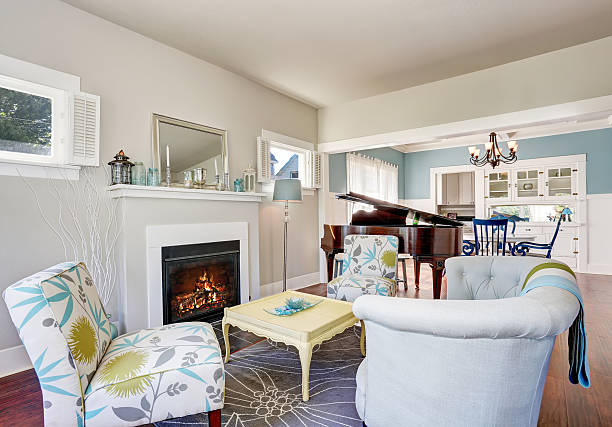 istock Modern living room with fireplace and piano at the background. 607732982