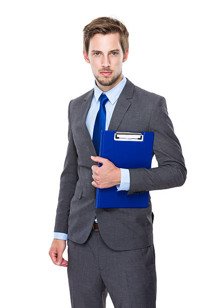istock Businessman holding a clipboard 607733066