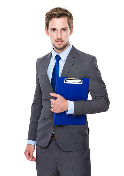 istock Businessman holding a clipboard 607733114