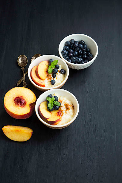 istock Rice pudding dessert with blueberry and peach 607733288