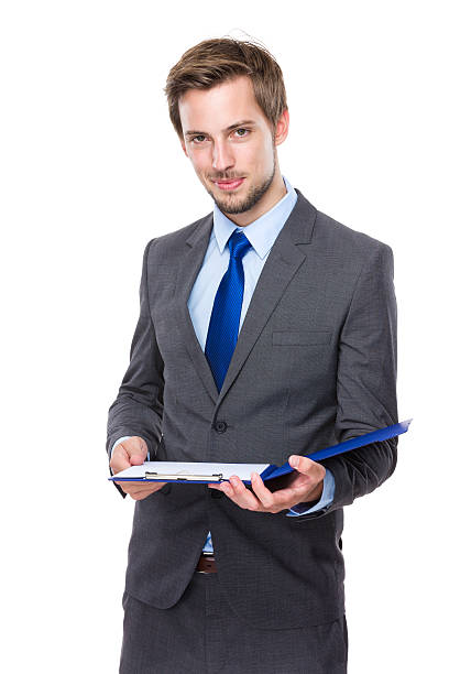 istock Businessman holding clipboard 607733734