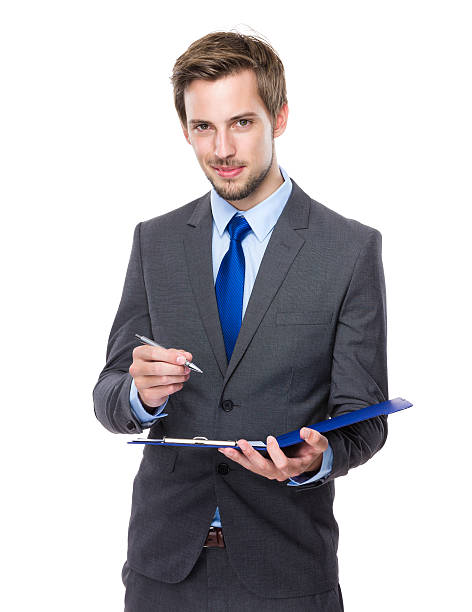 istock Businessman holding clipboard 607734060