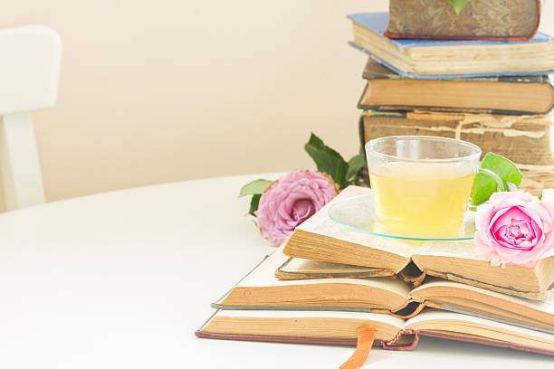 istock Cup of tea with books 607734646