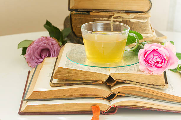 istock Cup of tea with books 607734760