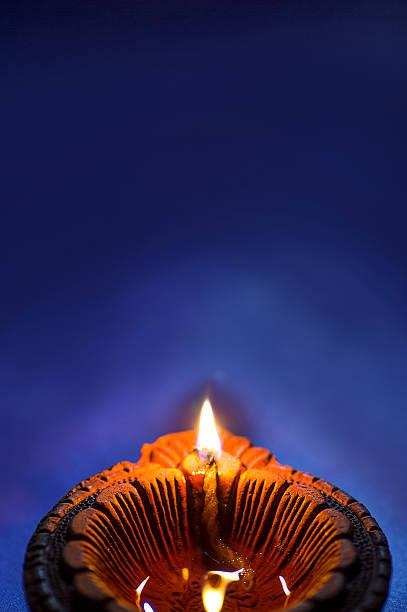 istock Clay diya lamps lit during Diwali Celebration. Greetings Card Design 607737510
