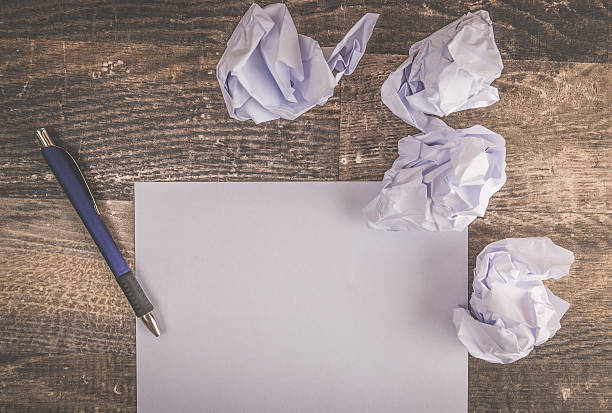 istock Writing a letter on an vintage hardwood table 607738814