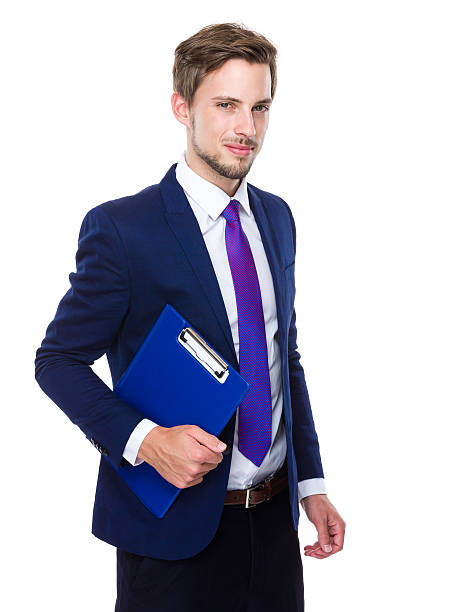 istock Businessman holding a clipboard 607739354