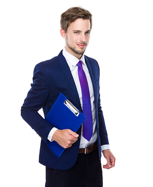 istock Businessman holding a clipboard 607739398
