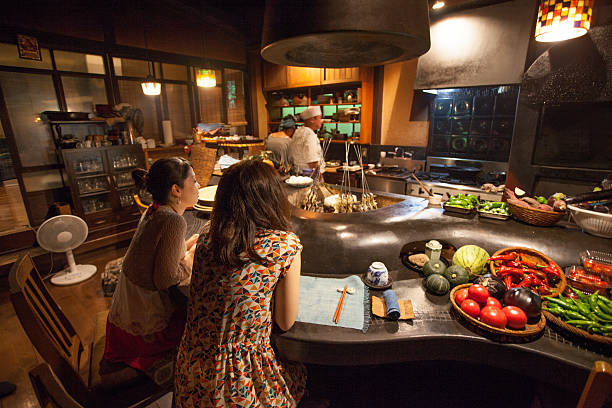 istock Japanese sisters at a traditional Japanese restaulant 607742458