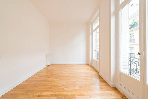 istock interior of empty room with parquet floor 607746578