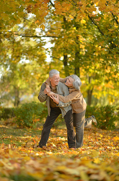istock Senior couple in autumn park 607746988