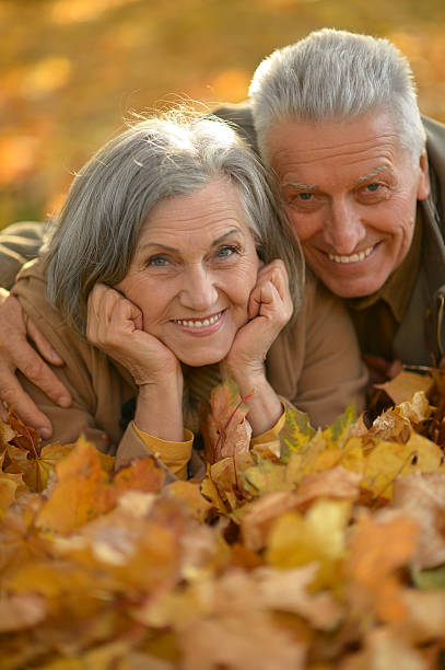 istock Senior couple in autumn park 607747186