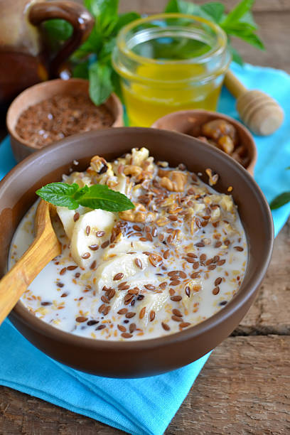 istock Granola with milk, walnuts and a banana for breakfast 607748214