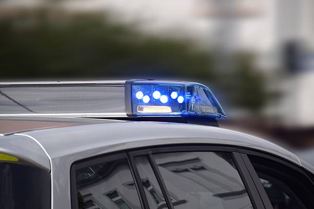 istock police car with blue lights switched on 607748246
