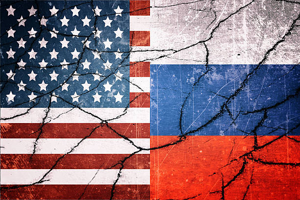 istock USA and Russia flags with cracks 607748712