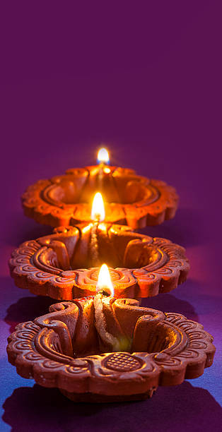 istock Clay diya lamps lit during Diwali Celebration. Greetings Card Design 607750988