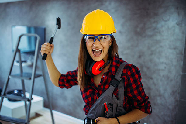 istock Crazy Handy woman holding hammer indoors 607752336