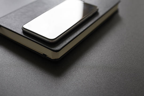 istock Business workplace with diary and mobile phone 607754242