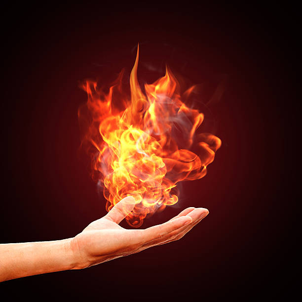 fire in hand stock photo
