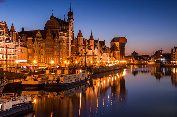istock Gdansk old town with harbor and medieval crane night view 607757598