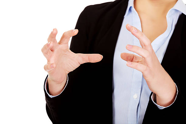istock Business woman holding something or copyspase between two hands 607757768