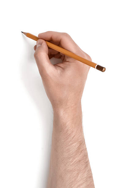 istock Man's hand holding a pencil isolated on white background 607757888