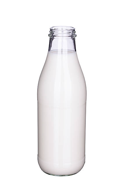 istock Open bottle of milk isolated (clipping path included) 607758592